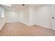Spacious basement room featuring hardwood floors and large windows at 895 Kings Grant Nw Dr, Atlanta, GA 30318