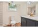 Basement bathroom with dark vanity, tile shower, and updated fixtures at 895 Kings Grant Nw Dr, Atlanta, GA 30318