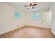 Bright bedroom with ceiling fan and wood-look flooring at 895 Kings Grant Nw Dr, Atlanta, GA 30318