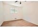 Well-lit bedroom featuring wood-look floors and a ceiling fan at 895 Kings Grant Nw Dr, Atlanta, GA 30318