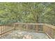Wooden deck overlooking a wooded backyard at 895 Kings Grant Nw Dr, Atlanta, GA 30318