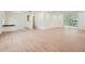 Spacious living room with light wood flooring and access to back deck at 895 Kings Grant Nw Dr, Atlanta, GA 30318