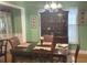 Formal dining room with wood table and hutch at 2280 Hickory Station Cir, Snellville, GA 30078