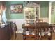 Dining room with wood table and china cabinet at 2280 Hickory Station Cir, Snellville, GA 30078