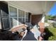 Relaxing front porch with wicker furniture and potted plants at 2280 Hickory Station Cir, Snellville, GA 30078