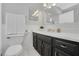 Clean bathroom, dark vanity, and updated fixtures at 285 Oxford Ne Pl # 4, Atlanta, GA 30307