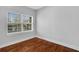 Bedroom with hardwood floors and large window at 285 Oxford Ne Pl # 4, Atlanta, GA 30307