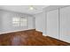Well-lit bedroom with hardwood floors and double closets at 285 Oxford Ne Pl # 4, Atlanta, GA 30307