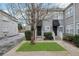 Gray duplex with black awnings, landscaping, and brick walkways at 285 Oxford Ne Pl # 4, Atlanta, GA 30307