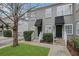Gray duplex with black awnings, landscaping, and brick walkways at 285 Oxford Ne Pl # 4, Atlanta, GA 30307
