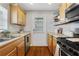 Kitchen boasts stainless steel appliances and wood cabinets at 285 Oxford Ne Pl # 4, Atlanta, GA 30307