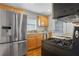 Modern kitchen with stainless steel appliances and wood cabinets at 285 Oxford Ne Pl # 4, Atlanta, GA 30307
