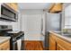 Updated kitchen with stainless steel appliances and wood cabinets at 285 Oxford Ne Pl # 4, Atlanta, GA 30307