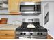 Stainless steel appliances and wood cabinets feature in this kitchen at 285 Oxford Ne Pl # 4, Atlanta, GA 30307