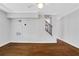 Living room features hardwood floors and an open staircase at 285 Oxford Ne Pl # 4, Atlanta, GA 30307