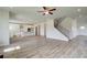 Open living room featuring hardwood floors, a ceiling fan, and views to the kitchen at 6 Homesite Blanton Ln, Stockbridge, GA 30281