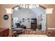 Dining area with chandelier and view into the living room at 10103 Harmon Springs Dr, Villa Rica, GA 30180