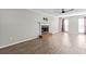 Living room with fireplace and wood-look floors at 1451 Laurel River Trl, Lawrenceville, GA 30043