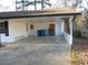 Covered carport with concrete flooring and storage area at 545 Oak Valley Dr, Riverdale, GA 30274