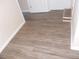 Gray-brown wood-look vinyl plank flooring in hallway at 545 Oak Valley Dr, Riverdale, GA 30274
