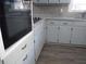 Renovated kitchen with granite countertops and new appliances at 545 Oak Valley Dr, Riverdale, GA 30274