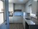 Updated kitchen featuring granite counters and stainless steel sink at 545 Oak Valley Dr, Riverdale, GA 30274