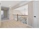 Upstairs hallway featuring carpet and views of the foyer and a modern chandelier at 909 Waterton Ct, Suwanee, GA 30024