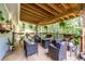 Relaxing covered deck with wicker furniture and fire pit at 2849 Crescendo Nw Dr, Atlanta, GA 30318