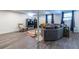 Finished basement with gray sectional sofa and wood-look floors at 2849 Crescendo Nw Dr, Atlanta, GA 30318