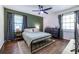 Bright bedroom with wood floors, large windows, and stylish decor at 2849 Crescendo Nw Dr, Atlanta, GA 30318