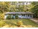 Newly painted blue brick ranch home with a spacious yard at 2849 Crescendo Nw Dr, Atlanta, GA 30318