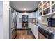 Modern kitchen with white cabinets, granite countertops, and stainless steel appliances at 2849 Crescendo Nw Dr, Atlanta, GA 30318