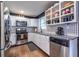 White cabinets, granite counters, and stainless steel appliances in this kitchen at 2849 Crescendo Nw Dr, Atlanta, GA 30318