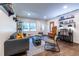 Bright living room with hardwood floors, comfy seating, and built-in shelving at 2849 Crescendo Nw Dr, Atlanta, GA 30318