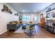 Living room with hardwood floors, gray sofa and green accent chair at 2849 Crescendo Nw Dr, Atlanta, GA 30318