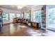 Sunroom with hardwood floors, built-in shelving, and large windows at 2849 Crescendo Nw Dr, Atlanta, GA 30318