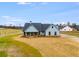 New construction farmhouse situated on a spacious lot with a long driveway at 628 Ridge Rd, Dallas, GA 30157