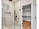 Modern bathroom with a large glass shower and closet access at 628 Ridge Rd, Dallas, GA 30157