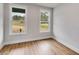 Bright bedroom with two windows and wood flooring at 628 Ridge Rd, Dallas, GA 30157