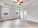 Spacious bedroom with wood-look floors, coffered ceiling, and large windows at 628 Ridge Rd, Dallas, GA 30157