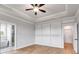 Bright bedroom featuring wood-look floors, coffered ceiling and wainscoting at 628 Ridge Rd, Dallas, GA 30157