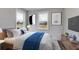 Spacious bedroom with a comfortable bed, plenty of natural light, and wood floors at 628 Ridge Rd, Dallas, GA 30157