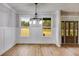 Bright dining room with hardwood floors and chandelier at 628 Ridge Rd, Dallas, GA 30157