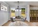 Bright dining room features a round table with four chairs, and large windows at 628 Ridge Rd, Dallas, GA 30157