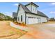 Attached garage with a side entry and additional exterior storage at 628 Ridge Rd, Dallas, GA 30157