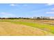 Open field with mature trees and distant homes at 628 Ridge Rd, Dallas, GA 30157
