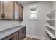 Walk-in pantry with shelving and gray countertop at 628 Ridge Rd, Dallas, GA 30157