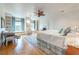 Spacious primary bedroom with hardwood floors and built-in shelving at 92 Old Ivy Ne Rd # 3, Atlanta, GA 30342