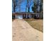 Brick ranch house with attached garage and landscaped yard at 976 Pine Roc Way, Stone Mountain, GA 30083