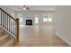 Living room with fireplace, hardwood floors and access to the kitchen at 1491 Stephens View Dr, Loganville, GA 30052